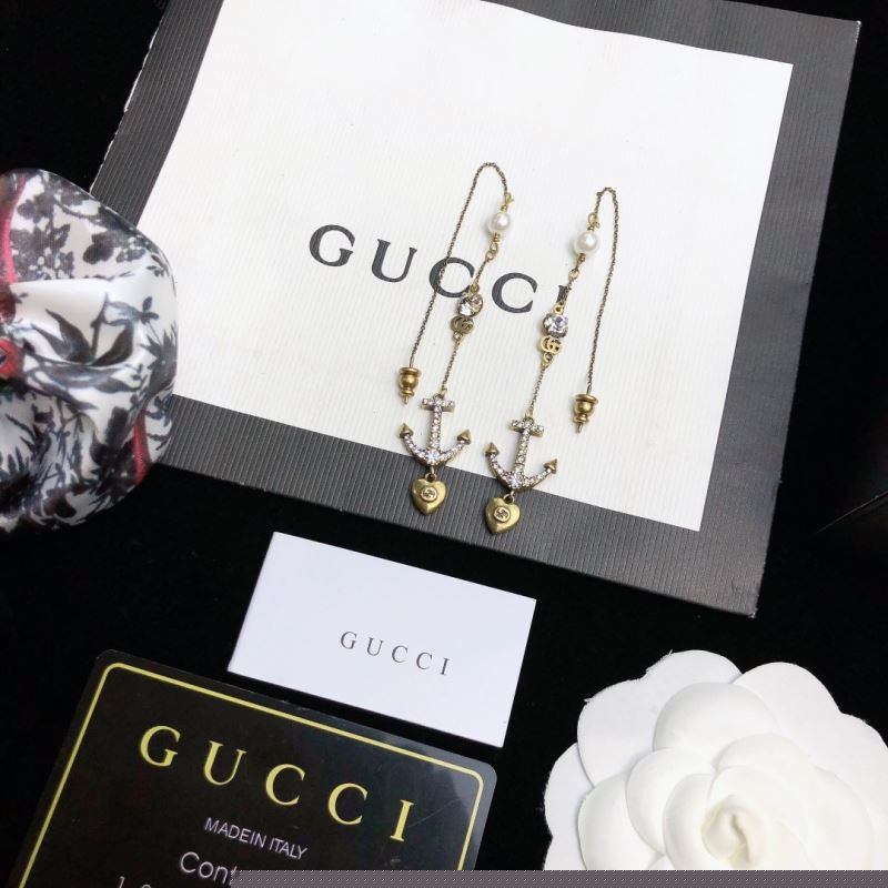 G*u*i earrings